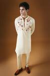 KOMAL KOTHARI_Ivory Cotton Embroidery Wild Flower 3d Kurta_at_Aza_Fashions