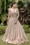 Buy_VRIDHI SOMAANI_Gold Organza Hand Embroidery Sequin Asymmetric Gemma Off Shoulder Ruffle Gown _at_Aza_Fashions