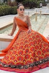 Buy_Neha Khullar_Orange Viscose Raw Silk Embellished Floral Geometric Mughal Printed Lehenga Set _at_Aza_Fashions