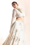 Ritika Mirchandani_Ivory Crepe Embroidery Floral Applique V Neck Abla Lehenga With Blouse _at_Aza_Fashions