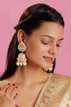 Buy Riana Jewellery Gold Plated Floral Carved Jadtar Stone Jhumkas at Aza Fashions Buy_Riana Jewellery_Gold Plated Floral Carved Jadtar Stone Jhumkas _at_Aza_Fashions