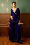 Buy_Reeti Arneja_Blue Micro Velvet Hand Embroidered Bead Lapel V Enigma Front Tie-up Jumpsuit _at_Aza_Fashions