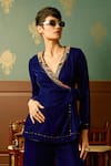 Shop_Reeti Arneja_Blue Micro Velvet Hand Embroidered Bead Lapel V Enigma Front Tie-up Jumpsuit _at_Aza_Fashions