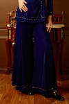 Reeti Arneja_Blue Micro Velvet Hand Embroidered Bead Lapel V Enigma Front Tie-up Jumpsuit _Online_at_Aza_Fashions