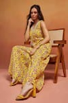 SHIKHA MALIK_Yellow 100% Cotton Print Floral V Neck Embellished Neckline Jumpsuit _Online_at_Aza_Fashions