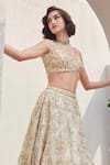 SAISHA_Ivory Organza Embroidered Sequin Floral Jaali 3d Embellished Bridal Lehenga Set _at_Aza_Fashions