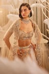 Shop_Swish By Dolcy And Simran_Ivory Net Embroidered Crystal Sweetheart Nike Floral Wave Bridal Lehenga Set _Online_at_Aza_Fashions