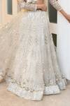 RONAK AND SHRUTI_Ivory Net Feathers, Embroidery, Crystals, Sequins, Stones V-neck Lehenga Set _Online_at_Aza_Fashions