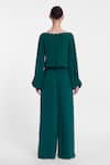 Shop_Gauri & Nainika_Green Crepe, Georgette Crystals, Pearls Boat Neck Embellished Jumpsuit _at_Aza_Fashions