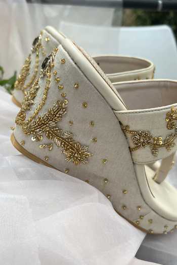 Shop_Shradha Hedau Footwear Couture_Ivory Cut Work, Sequins Beige Cutdana Floral Wedges _at_Aza_Fashions