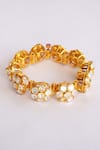 Shop Zevar By Geeta Gold Plated Imitation Diamonds Floral Carved Moissanite Bracelet at Aza Fashions Shop_Zevar By Geeta_Gold Plated Imitation Diamonds Floral Carved Moissanite Bracelet _at_Aza_Fashions