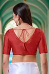 Shop Samyukta Singhania Red Silk V-neck Half Sleeve Blouse at Aza Fashions Shop_Samyukta Singhania_Red Silk V-neck Half Sleeve Blouse_at_Aza_Fashions