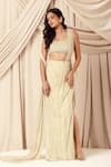 Buy_Charu and Vasundhara_Ivory Saree And Pallu Net Embroidered Bead Viola Pre-draped With Tasseled Blouse _at_Aza_Fashions