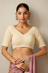 Buy_Naintara Bajaj_Cream Lace V-neck Embellished V Blouse _at_Aza_Fashions