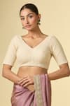 Shop_Naintara Bajaj_Cream Lace V-neck Embellished V Blouse _Online_at_Aza_Fashions