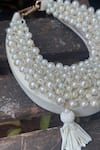Bhavna Kumar_White Pearls, Tassels Embellished Moon Mini Bag _at_Aza_Fashions