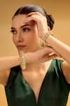 Buy_Samyukta Singhania_Gold Plated Crystals And White Stone Embellished Bangles _at_Aza_Fashions