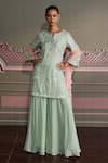 Buy_Mustard Moon by Neyha and Vrinda_Green Georgette, Net Embroidery, Sequins, Tassels V-neck Saanvi Sage Kurta Set _at_Aza_Fashions