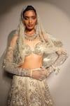 Megha Bansal_Gold Silk Organza Sequins, Embroidery Ecru Tuscan Bloom Petal Lehenga Set _at_Aza_Fashions