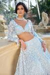 Seema Gujral_Blue Net Embroidery, Applique V-neck Three-dimensional Lehenga Set _at_Aza_Fashions