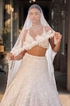 Shop_Seema Gujral_Ivory Net Sequins, Embroidery V-neck Floral Lehenga Set _at_Aza_Fashions