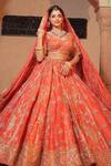 Buy_Amaltas Couture_Rust Tissue Sequins, Cut Work, Beads Round Neck Orange Bridal Lehenga Set _at_Aza_Fashions