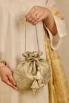 Buy_AMYRA_Gold Embroidery, Tassels Tarang Cutwork Potli Bag _Online_at_Aza_Fashions