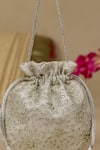 Shop_AMYRA_Silver Embroidery, Tassels Tarang Cutwork Potli Bag _Online_at_Aza_Fashions