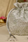 AMYRA_Silver Embroidery, Tassels Tarang Cutwork Potli Bag _at_Aza_Fashions