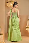 Shop_K&A By Karishma and Ashita_Green Net, Satin Beads, Embroidery, Sequins Light Pre-draped Saree And Corset _at_Aza_Fashions