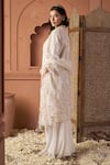 Shop_Tasuvure Indes_Ivory Net Sequins Collared Tunic And Skirt Set _at_Aza_Fashions