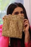 Buy_A Clutch Story_Gold Sequins, Tassels Antique Embroidered Potli _at_Aza_Fashions