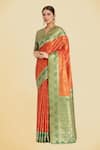 Buy_Samyukta Singhania_Orange Embroidery V-neck Banarasi Tissue Silk Saree Set _at_Aza_Fashions