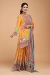 Shop_NIRRAAMYAA_Mustard Brocade, Georgette Rhinestones Round Neck Designer Yellow Kurta Set _Online_at_Aza_Fashions
