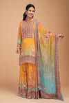 NIRRAAMYAA_Mustard Brocade, Georgette Rhinestones Round Neck Designer Yellow Kurta Set _at_Aza_Fashions