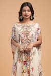 NIRRAAMYAA_Beige Organza Rhinestones Round Neck Floral Embroidered Kurta Lehenga Set _at_Aza_Fashions