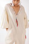 Nikasha_Cream Cotton Tassels, Embroidery V-neck Chilly Seersucker Jumpsuit _Online_at_Aza_Fashions