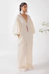 Buy_Nikasha_Cream Cotton Tassels, Embroidery V-neck Chilly Seersucker Jumpsuit _Online_at_Aza_Fashions