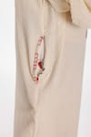 Shop_Nikasha_Cream Cotton Tassels, Embroidery V-neck Chilly Seersucker Jumpsuit _Online_at_Aza_Fashions