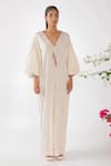 Nikasha_Cream Cotton Tassels, Embroidery V-neck Chilly Seersucker Jumpsuit _at_Aza_Fashions