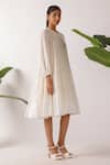 Nikasha_Cream Cotton Fabric Flowers Round Neck Jamdani Embroidered Yoke Tier Dress _at_Aza_Fashions