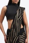 ABRAHAM AND THAKORE_Black Georgette Sequins Broken Stripes Saree _at_Aza_Fashions