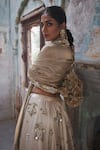 Buy_Etasha by Asha Jain_Ivory Silk, Tissue Sequins, Embroidery Halter Neck And Gold Lehenga Set _Online_at_Aza_Fashions