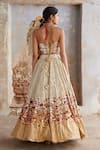 Shop_Etasha by Asha Jain_Gold Silk Embroidery, Sequins Halter Neck Textured Lehenga And Waistcoat Set _at_Aza_Fashions