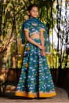 Buy_YUVRAANI JAIPUR_Blue Chanderi, Cotton, Net Lace Teal Printed Lehenga Set _Online_at_Aza_Fashions