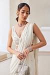 Label Sanya Gulati_White Georgette Zari, Pearls, Sequins V-neck Designer Pre-draped Saree And Blouse _at_Aza_Fashions