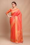 Buy_Samyukta Singhania_Orange Silk Embroidery Round Neck Handloom Woven Saree With Blouse _at_Aza_Fashions