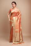 Buy_Samyukta Singhania_Orange Tissue Embroidery Plunge Neck Flower Woven Saree With Blouse _at_Aza_Fashions