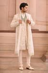 Buy_MUKTI AND KAVITH CASA_Ivory Silk Embroidery Threadwork Embellished Sherwani Set _at_Aza_Fashions