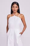 Dev And Viv_White Linen Halter Neck Jumpsuit _Online_at_Aza_Fashions